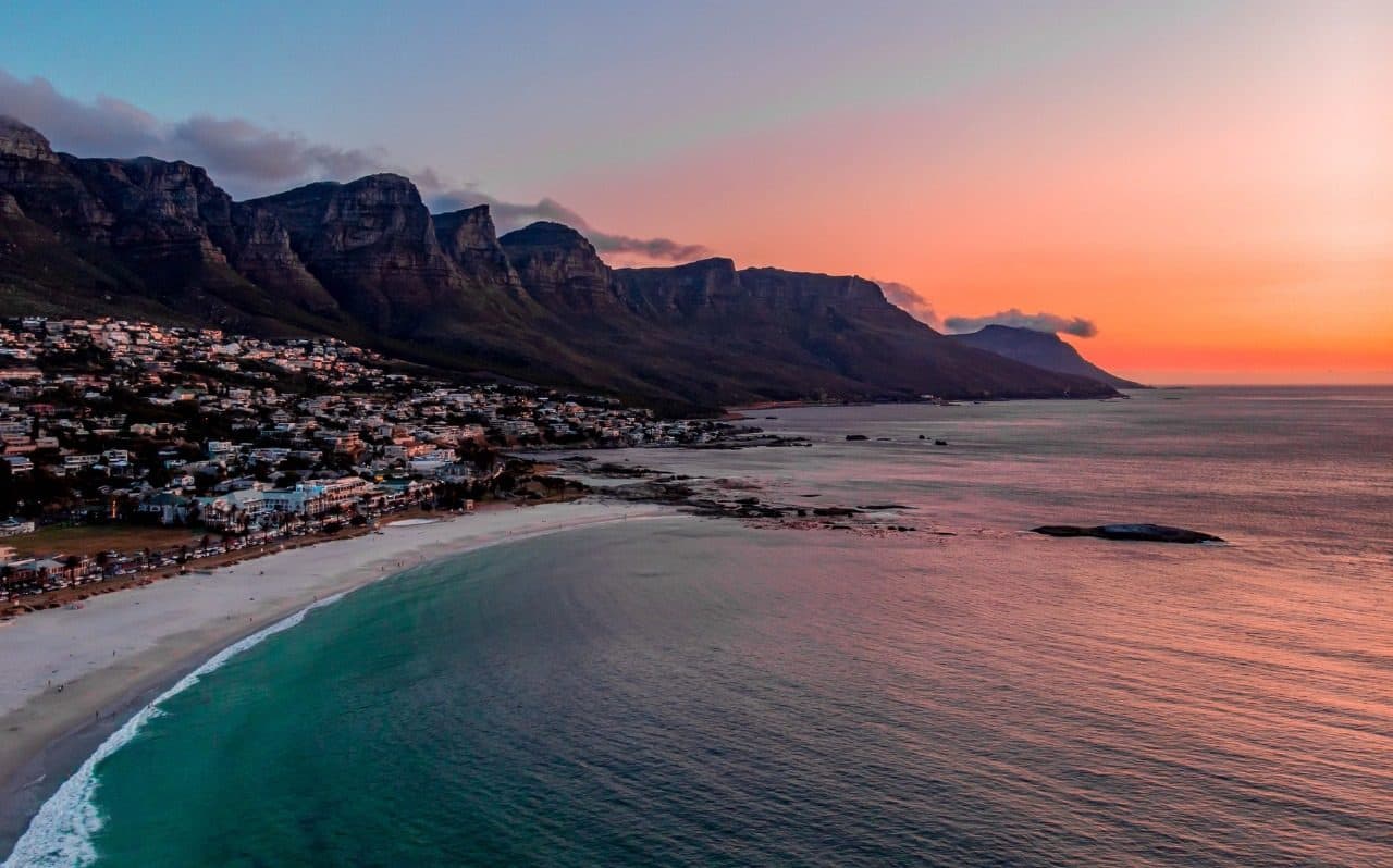 Camps Bay beach and the Twelve Apostles at sunset, Cape Town