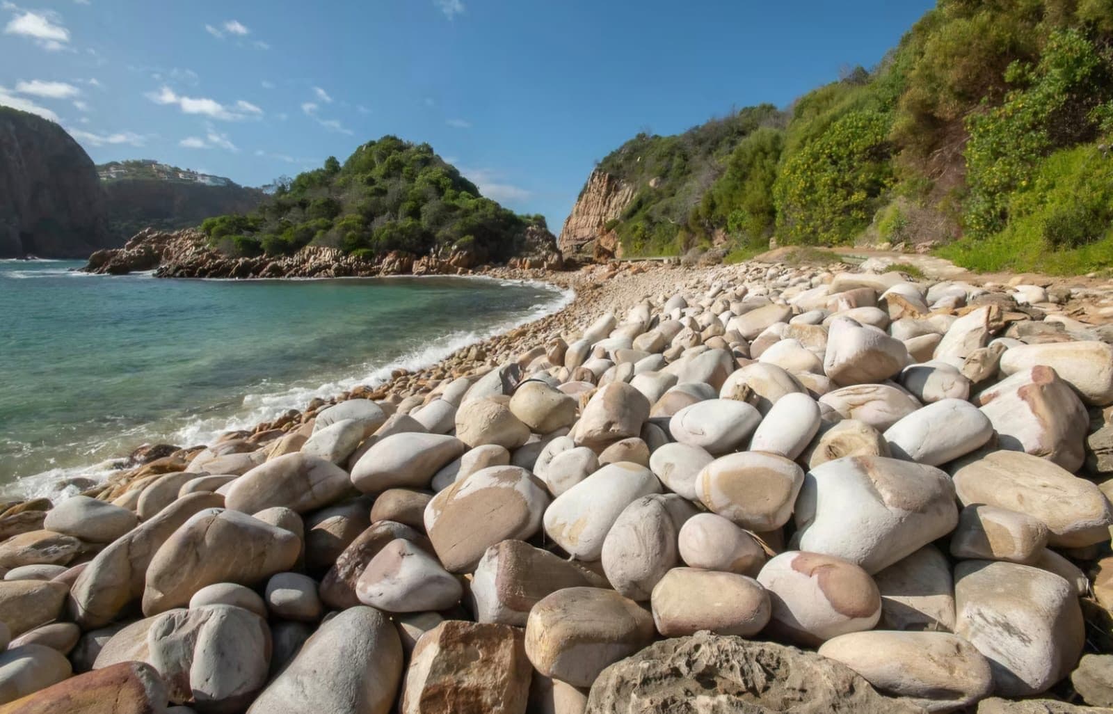 Rounded boulders on a beach along the Eastern Cape coast